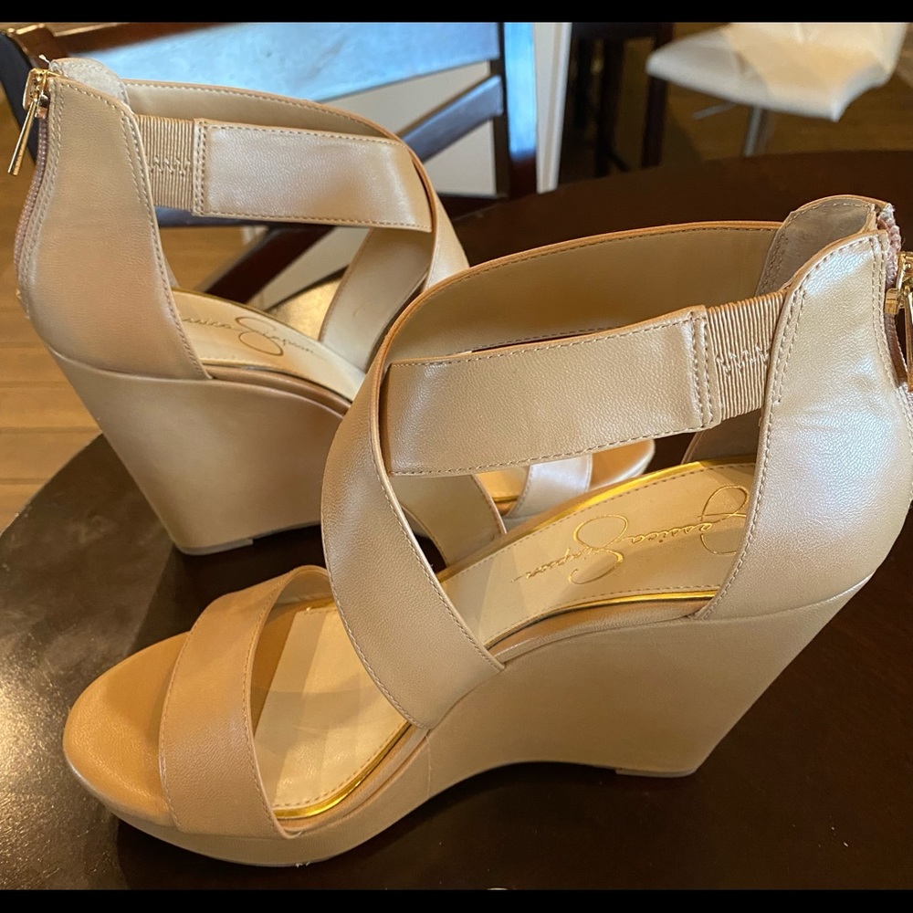 Never been worn tan wedges. Heel zip.
